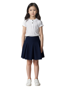 Young girl wearing a white polo shirt and navy skirt on a white background